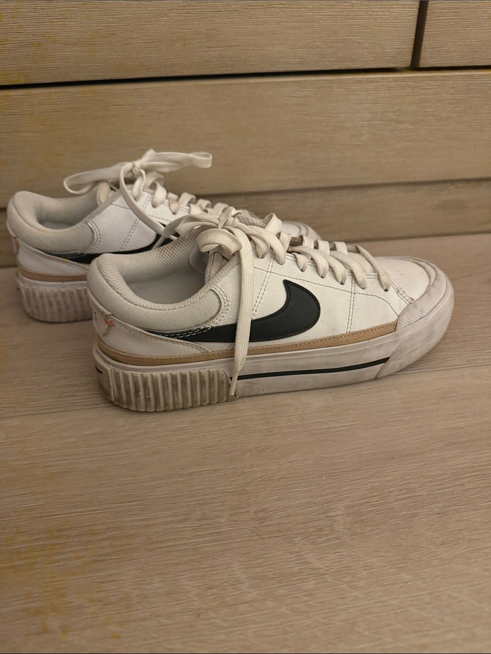 Nike White Sneakers with Black Swoosh and Tan Stripe